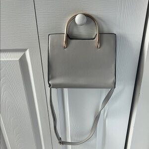 Gray Handbag with gold handles and cross body